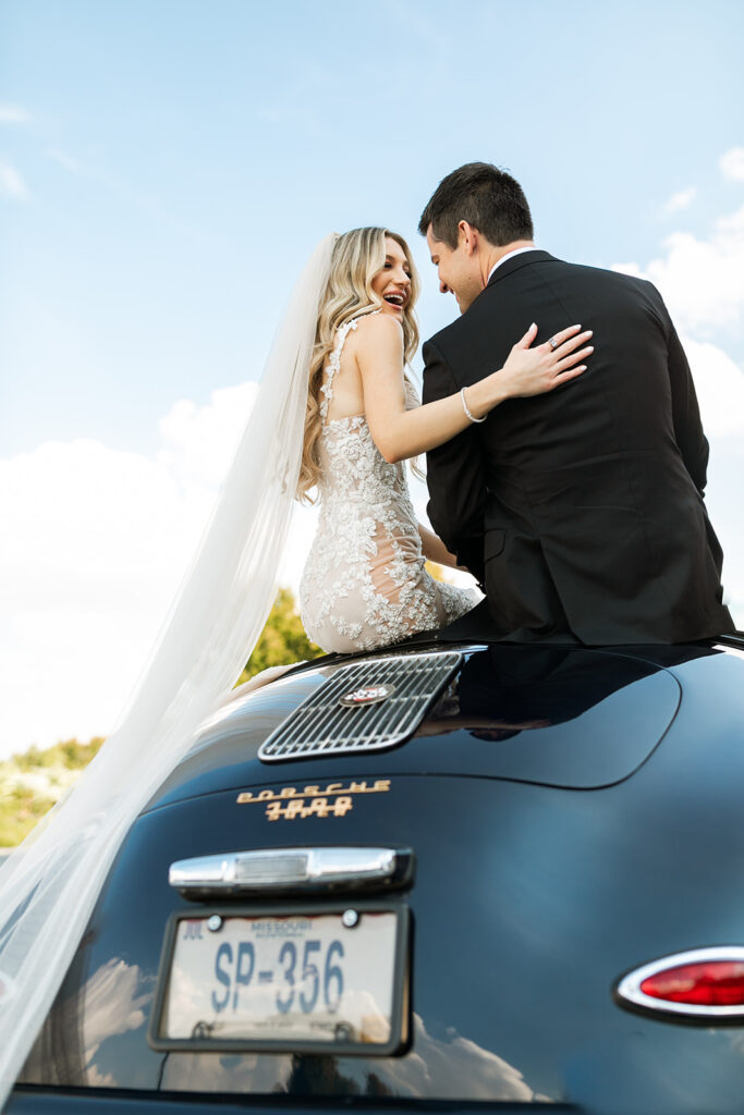bride and groom in a getaway car after wedding