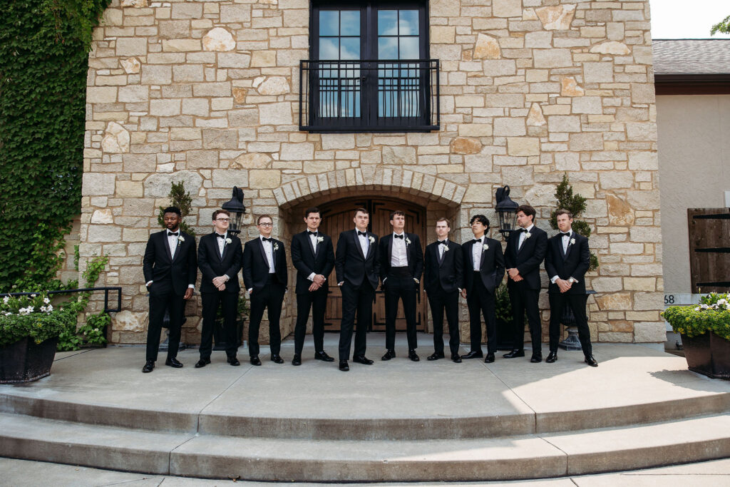 groom poses with groomsmen at Silver Oaks Chateau wedding