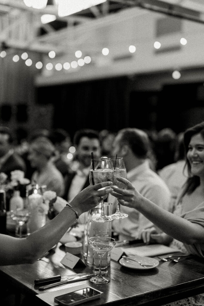 wedding guests cheers champagne during wedding toasts