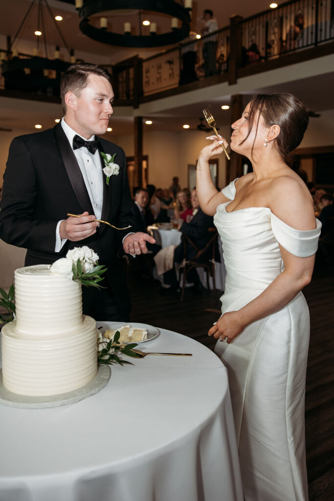 bride and groom at cake cutting