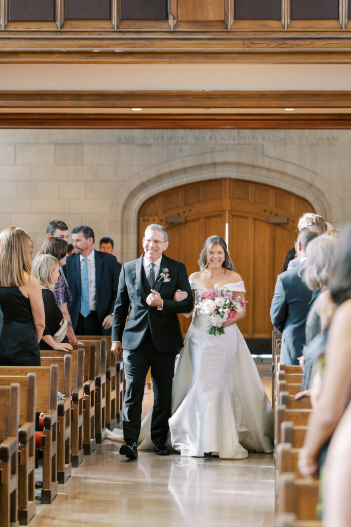 bride walking down aisle at Graham Chapel