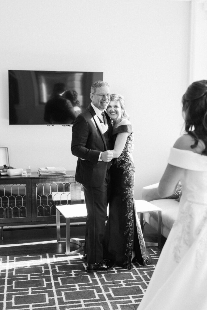 parents admiring bride